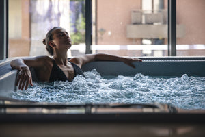 young woman is relaxing in hot tub